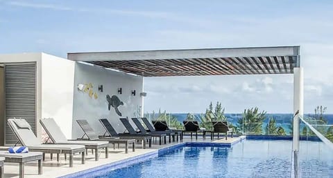 Take a refreshing dip in the oceanview rooftop pool.
