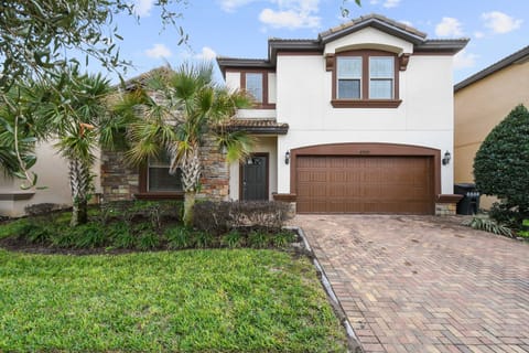 Charming villa with private pool, lush landscaping, and peaceful neighborhood vibes.