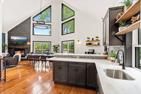 Open concept kitchen, dining room and living room with stunning lake views