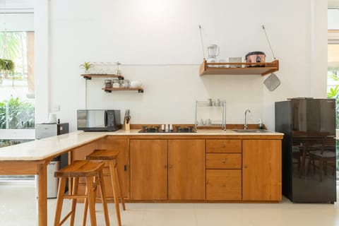 Spacious kitchenette with modern appliances and ample counter space