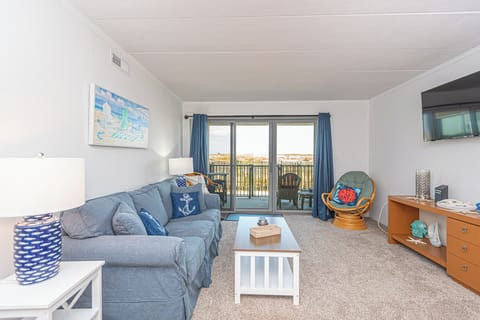 Living room with balcony to beach.  Plenty of sitting room!