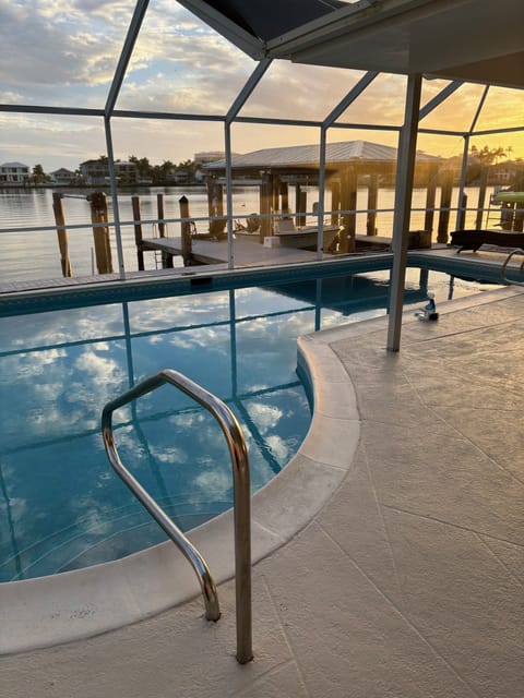 Enjoy the beautiful views of the bay sunset while relaxing in the heated pool. 