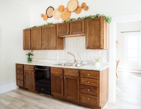 Fully stocked kitchen with a dishwasher.