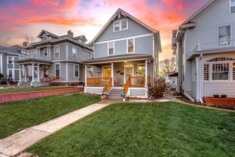 Charming front porch with sunset views and cozy seating.