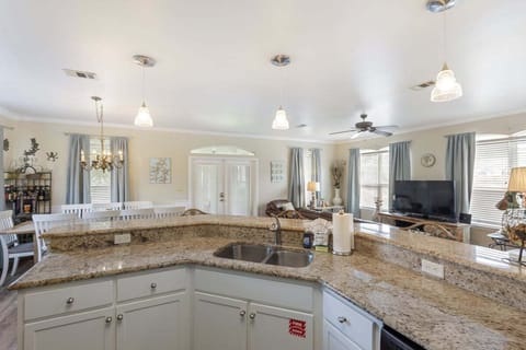 View of dining space and living room from kitchen.