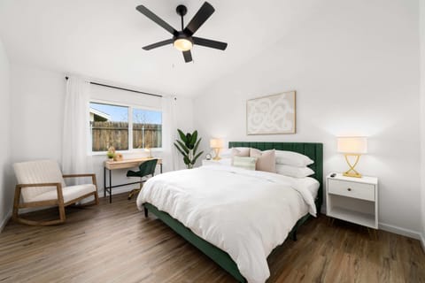 Relax in this spacious, beautifully designed bedroom with its own private en suite bathroom and a designated desk for your workspace.