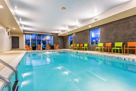 Swim at dusk under soothing lights for total relaxation.