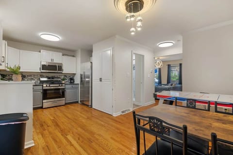 A beautiful view of our kitchen, dining area and air hockey table. Explore ultimate comfort!