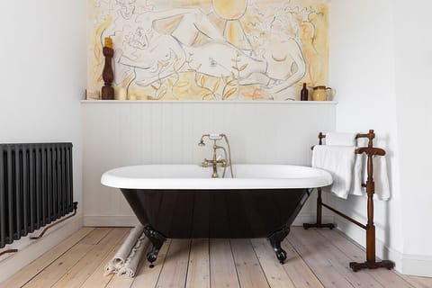 Main bedroom dressing area with roll top