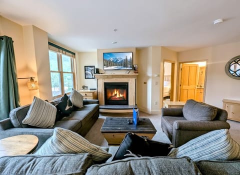 Sink into plush seating while your crackling fireplace warms the room and mountain scenes play overhead.