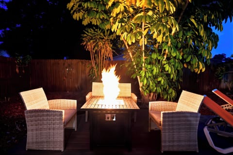 Cuddle up by the Propane Fire Pit on the Comfortable Outdoor Furniture