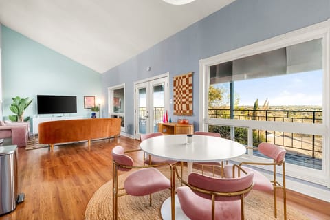 20 ft Vaulted Ceilings. Large open Windows with views of East Austin Hills. 

