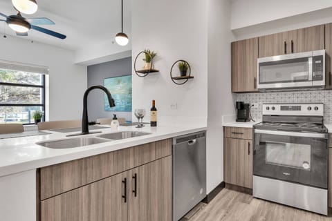 Kitchen includes a refrigerator, microwave, dishwasher, electric range, Keurig pod coffee maker, toaster & much more!