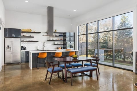 Huge, fully-stocked chef`s kitchen with all the high-end appliances and cooking essentials you might need. Seating for six at the dining table.