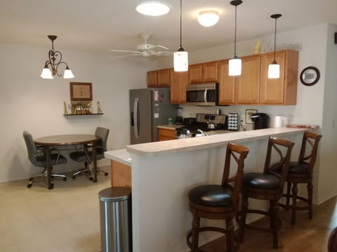 Kitchen with countertop and 3 chairs