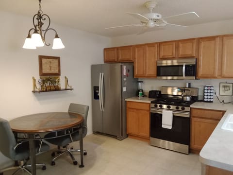 Kitchen with table and 2 chairs
