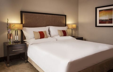 Drift off in a serene bedroom with soft lighting.