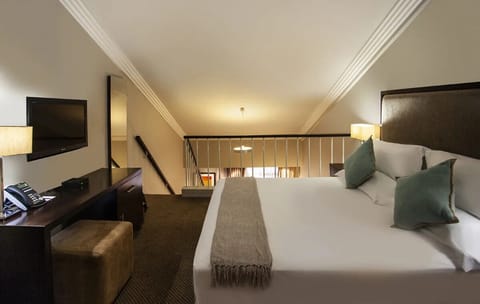 Stretch out in a spacious room designed for effortless comfort.