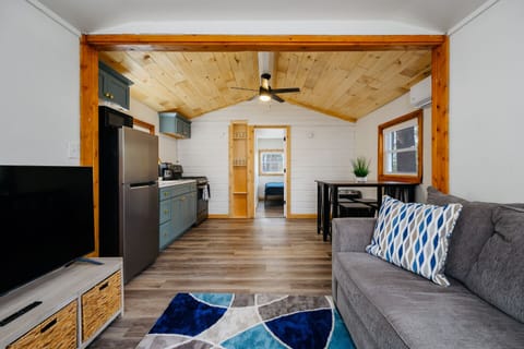 Living Space: Bright open layout with charming decor and modern kitchen for delightful gatherings!