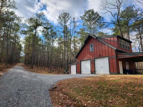Located down a tree-lined dirt and gravel driveway, shared with the main house.