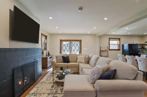 Comfy sectional, 65" smart TV with YouTube TV service and propane fireplace