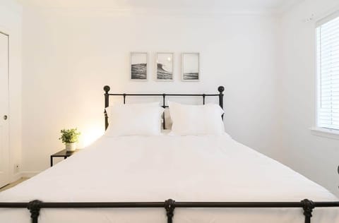 Comfortable and Sparkling Clean Queen Size Bedroom with view to the pool. 