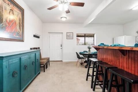 Inside View of Buller Studio Flat's Breakfast Bar with Seating and Kitchen Table