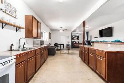 Fully Equipped Kitchen with Pots, Pans, Utensils, Dishes, Glassware, and Cutlery