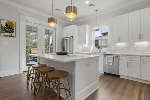 Seating for four at the island; dining table seats 6.