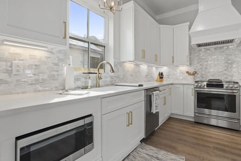 Microwave, dishwasher, and 6-burner gas stove.