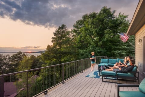 Incredible views of Crystal Lake sunsets paired with spacious rooms and shared spaces set this home apart for your next vacation in NW Michigan.