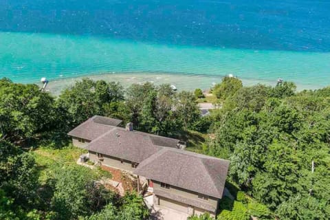 Your home away from home showcases expansive views of Crystal Lake greet you both inside and out!  This secluded retreat on a bluff overlooking Crystal Lake is perfect for large group getaways, family vacations, and reunions with friends.
