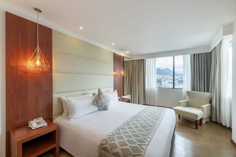 Relax in a bright corner room with panoramic city views.