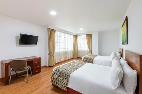 Settle into bright twin beds with plenty of space.