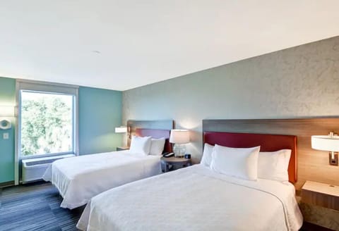 Stretch out on plush double beds for effortless, restful sleep.