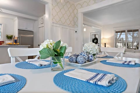 Elegant Dining: A Chic Space Where Bold Blues and Delicate Patterns Meet for Memorable Meals and Conversation