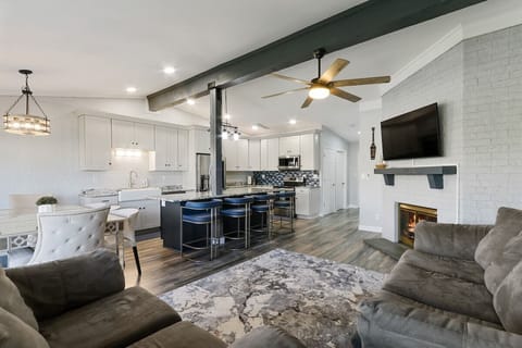 Open concept kitchen, living room to dining area