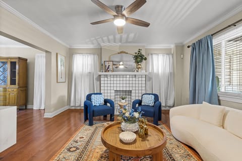 Living room fireplace nearby two eclectic conversation chairs by the living room