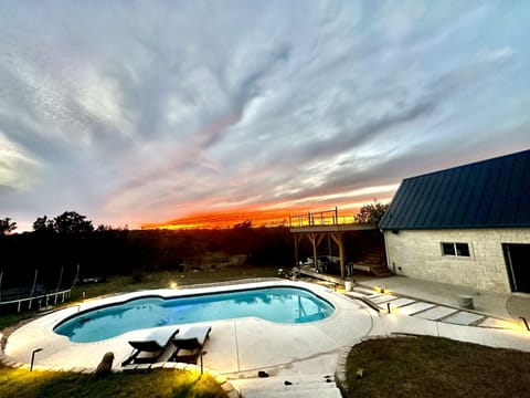 Gorgeous greenbelt view with pool and rooftop deck