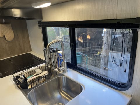 Looking out the kitchen window you can see right into our goat barn.