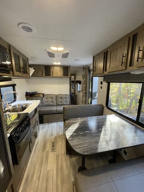 The kitchen table and couch both turn into beds for kids to sleep on