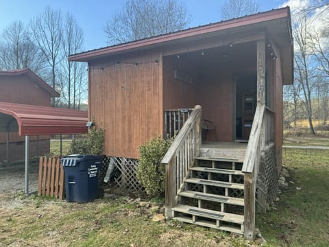 Each Cabin offers an inviting front porch with seating to enjoy the view