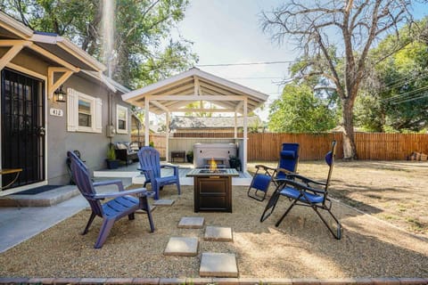 Hot tub and firepit in the fenced backyard
