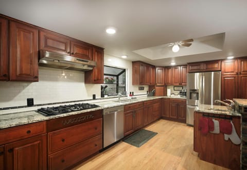Large kitchen fully furnished to prepare your own meals.
