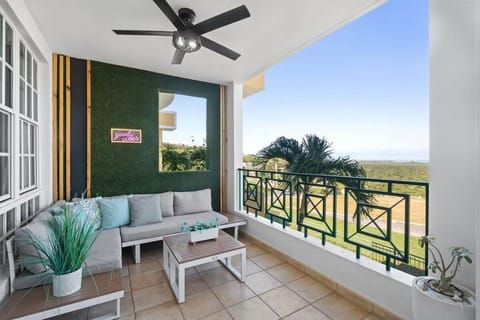 Chic balcony featuring comfortable sofa and beautiful views.