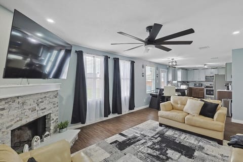 Furnished with plush couches, a centerpiece fireplace, and a large wall-mounted TV, there’s everything here for you to sit back, relax, and enjoy your stay!