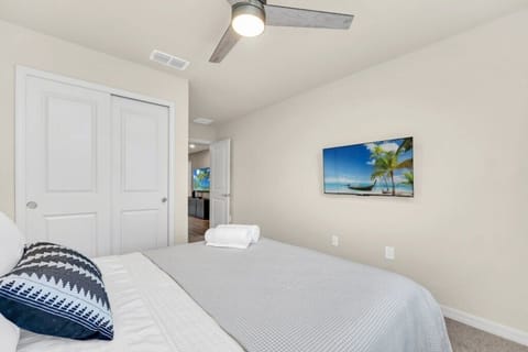 - Cozy bedroom retreat - comfortable bed, TV, and ceiling fan for restful nights in a peaceful space  