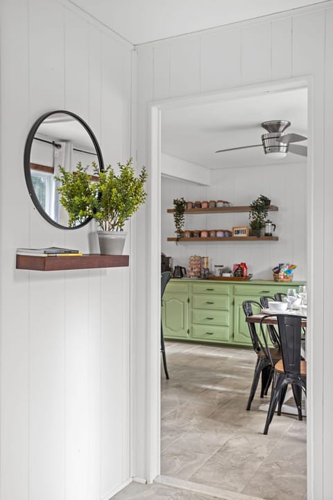 A charming peek into the dining space, showcasing an inviting setup with a mix of modern and rustic elements.
