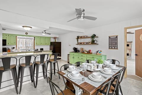 A spacious dining area seamlessly blending into the kitchen, perfect for entertaining and group gatherings.