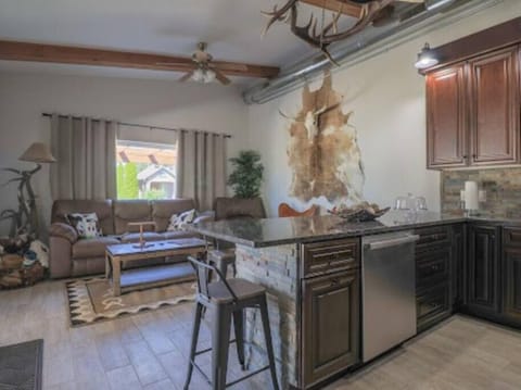 Accommodations with a western theme. Living room and designer kitchen open out to a large patio.